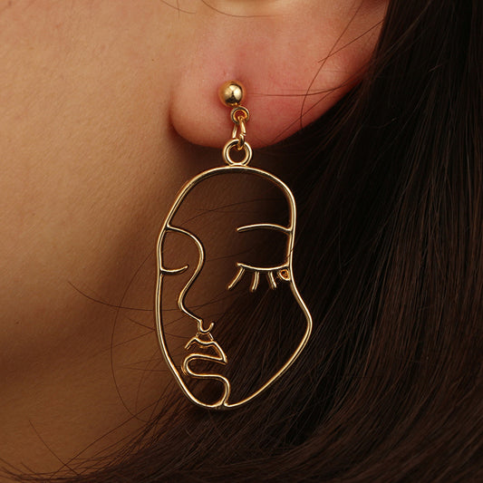 Hollowed Out Human Face Art Deco Earrings