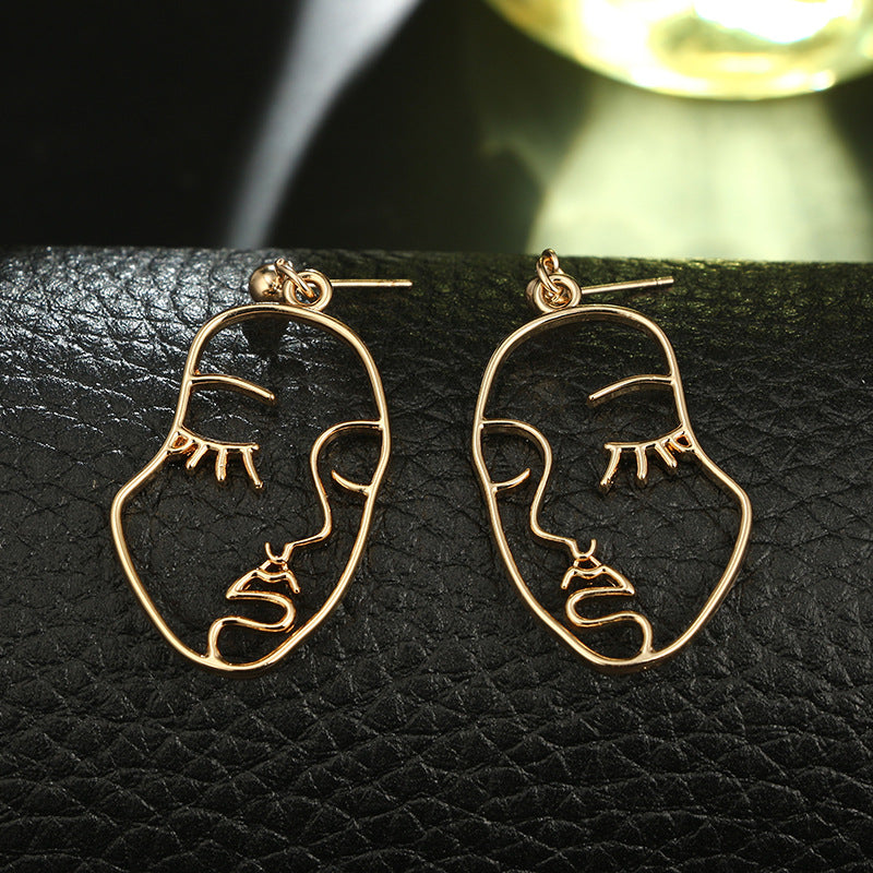 Hollowed Out Human Face Art Deco Earrings