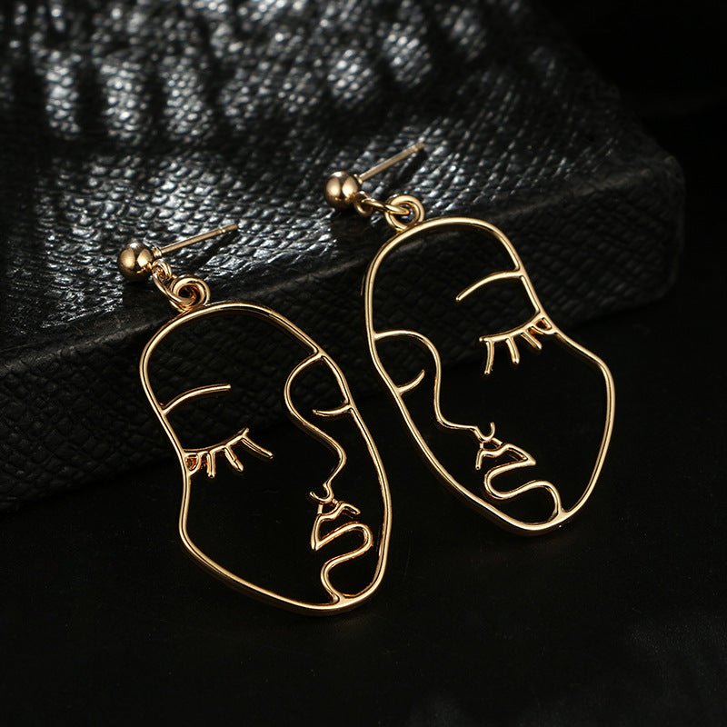Hollowed Out Human Face Art Deco Earrings